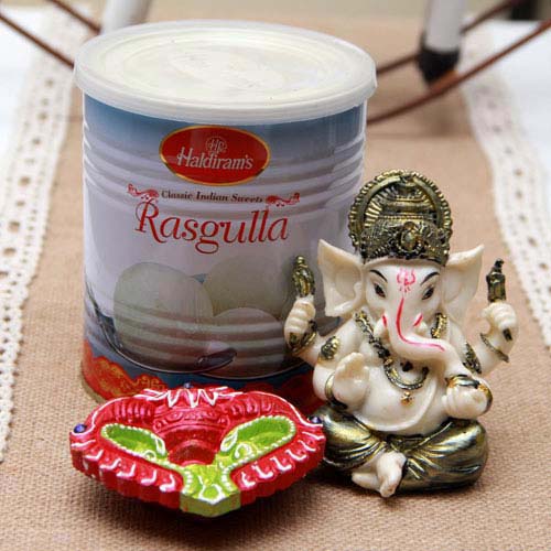 Ganesh Idol Haldiram Rasgulla and terracotta Diya