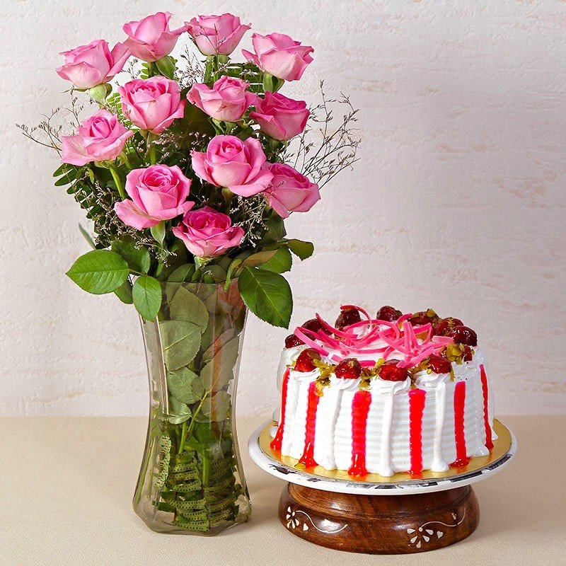Strawberry Cake With Dozen Pink Roses In A Glass Vase